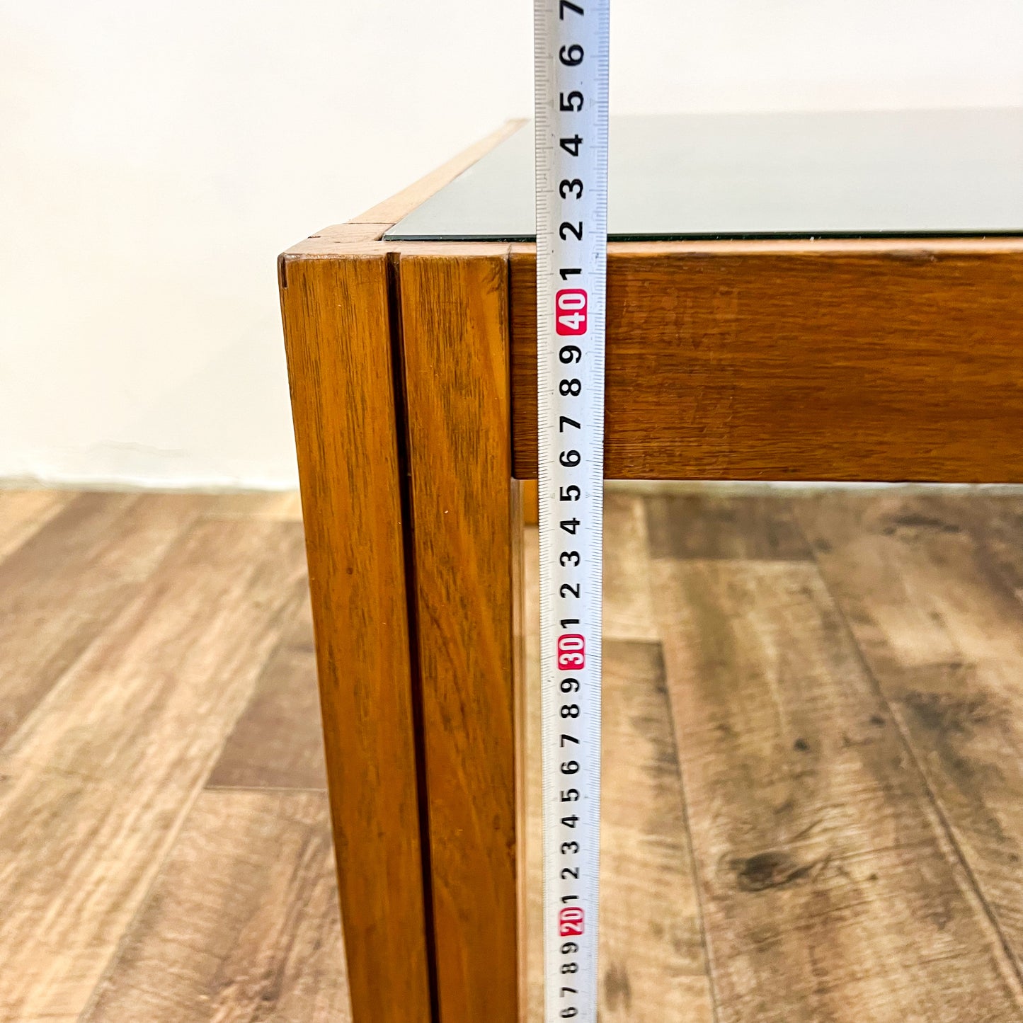 Large square wooden coffee table with Smokey glass top