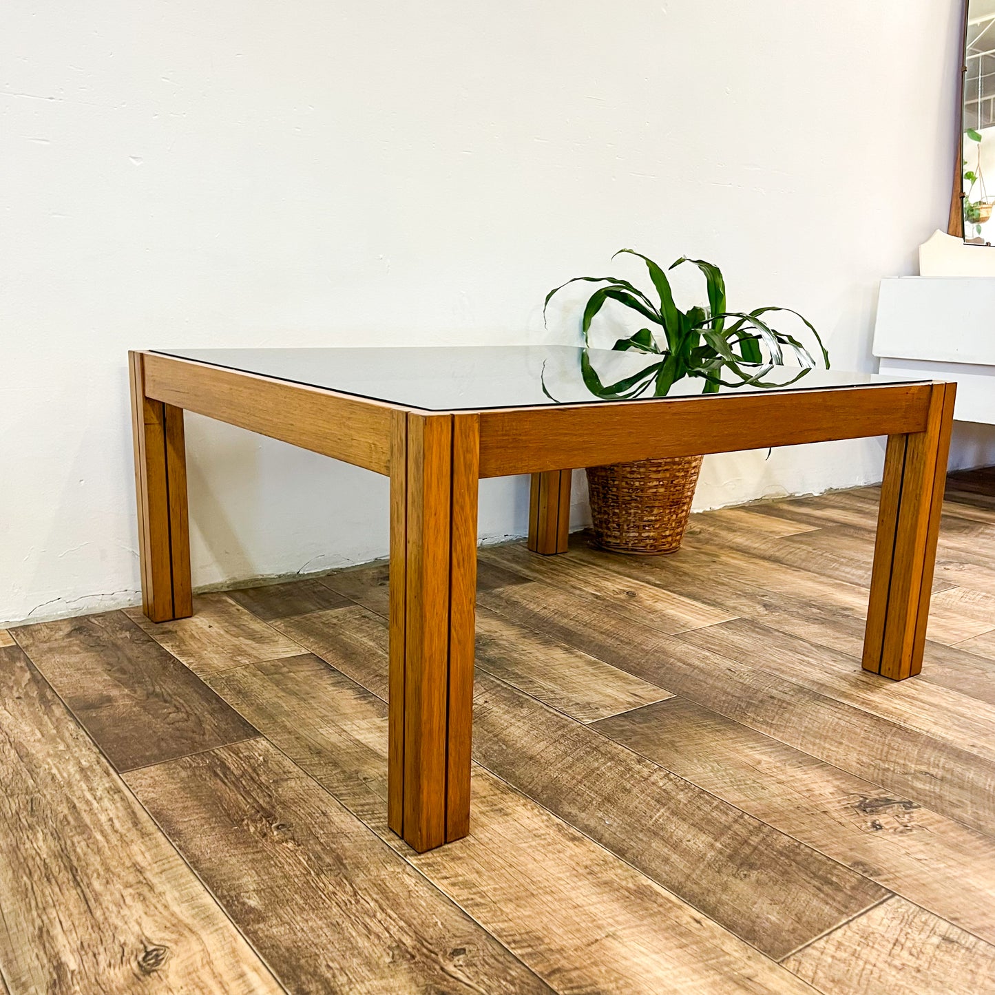 Large square wooden coffee table with Smokey glass top