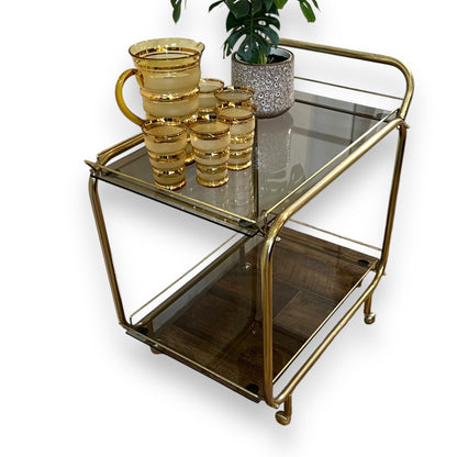 Brass two tier bar dart trolley with Smokey glass shelves