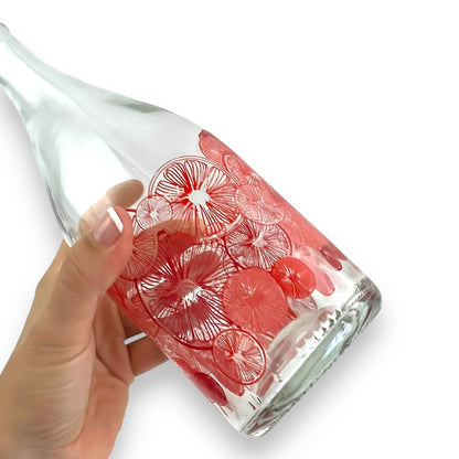 Red citrus pattern glass bottle