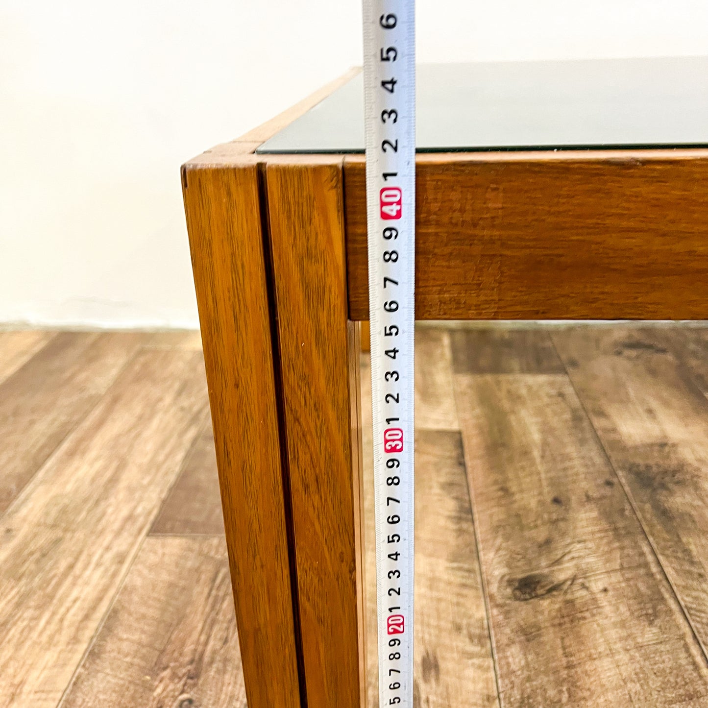 Large square wooden coffee table with Smokey glass top