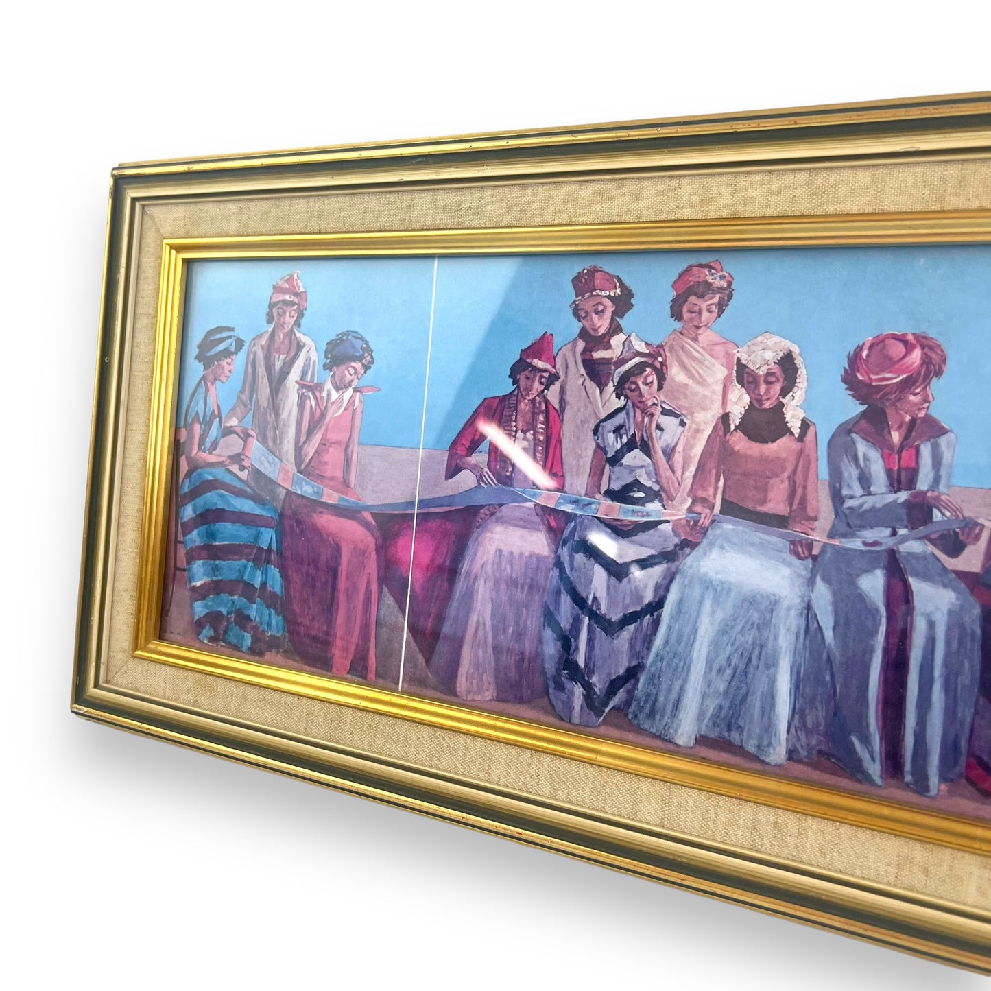 Gold framed print of women reading a scroll dressed in beautiful dresses