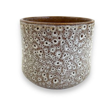 Brown and white speckled glazed plant pot