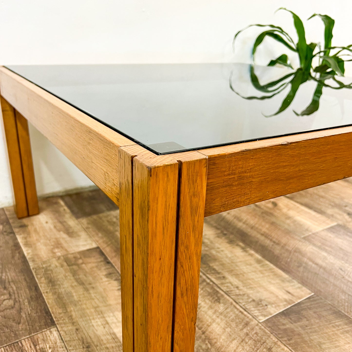 Large square wooden coffee table with Smokey glass top