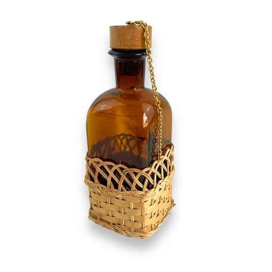 Amber glass decanter bottle with cane base and cork stopper